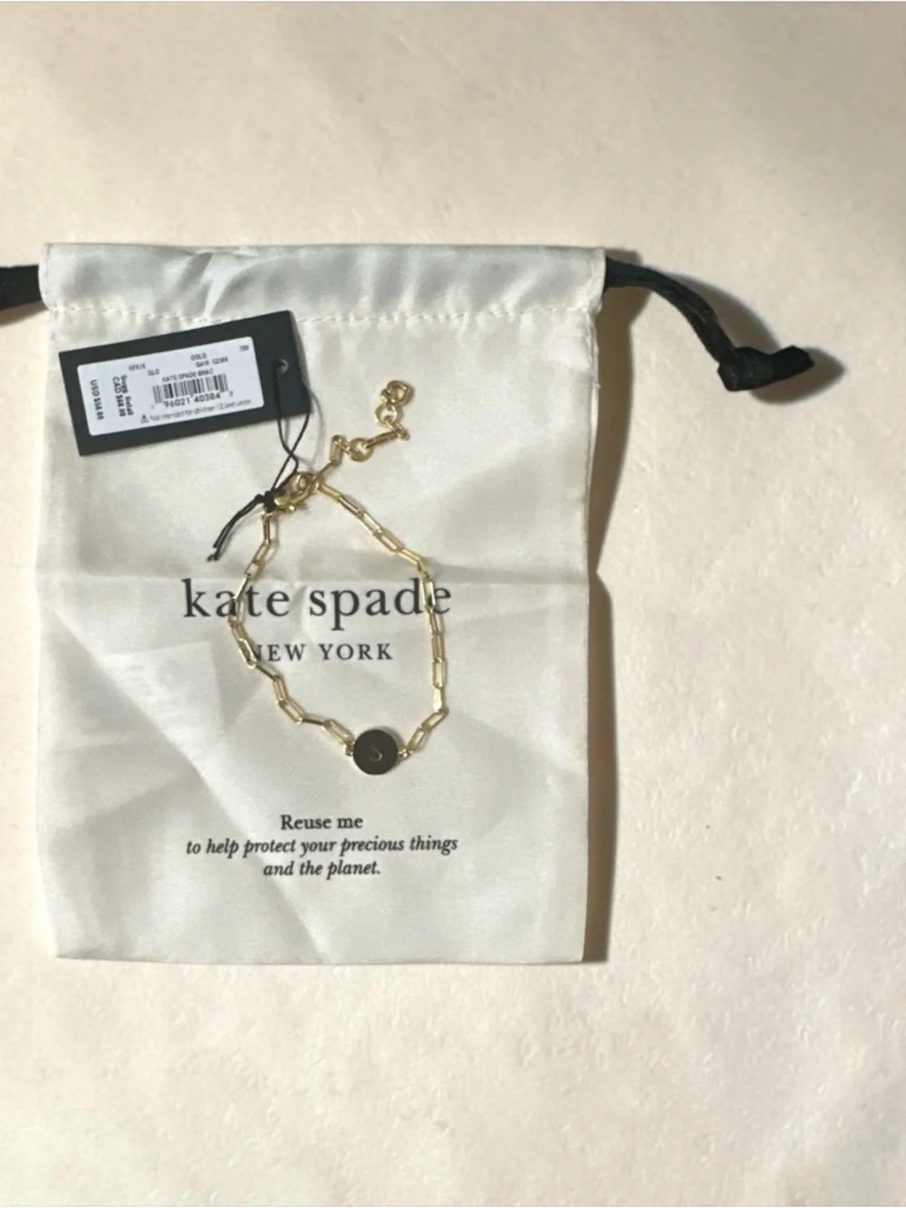 kate spade Gold Paperclip Bracelet with 'S' Disc comes with dust bag. - Picture 2 of 2